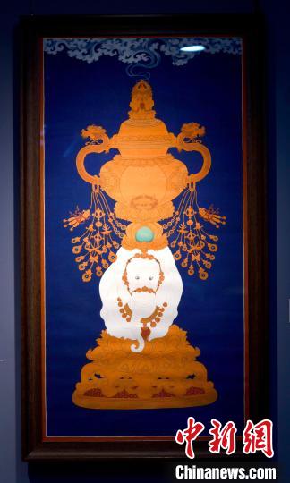 圖為5月16日，展覽中的新創(chuàng)唐卡作品《瑞象承香》?！±盍?攝